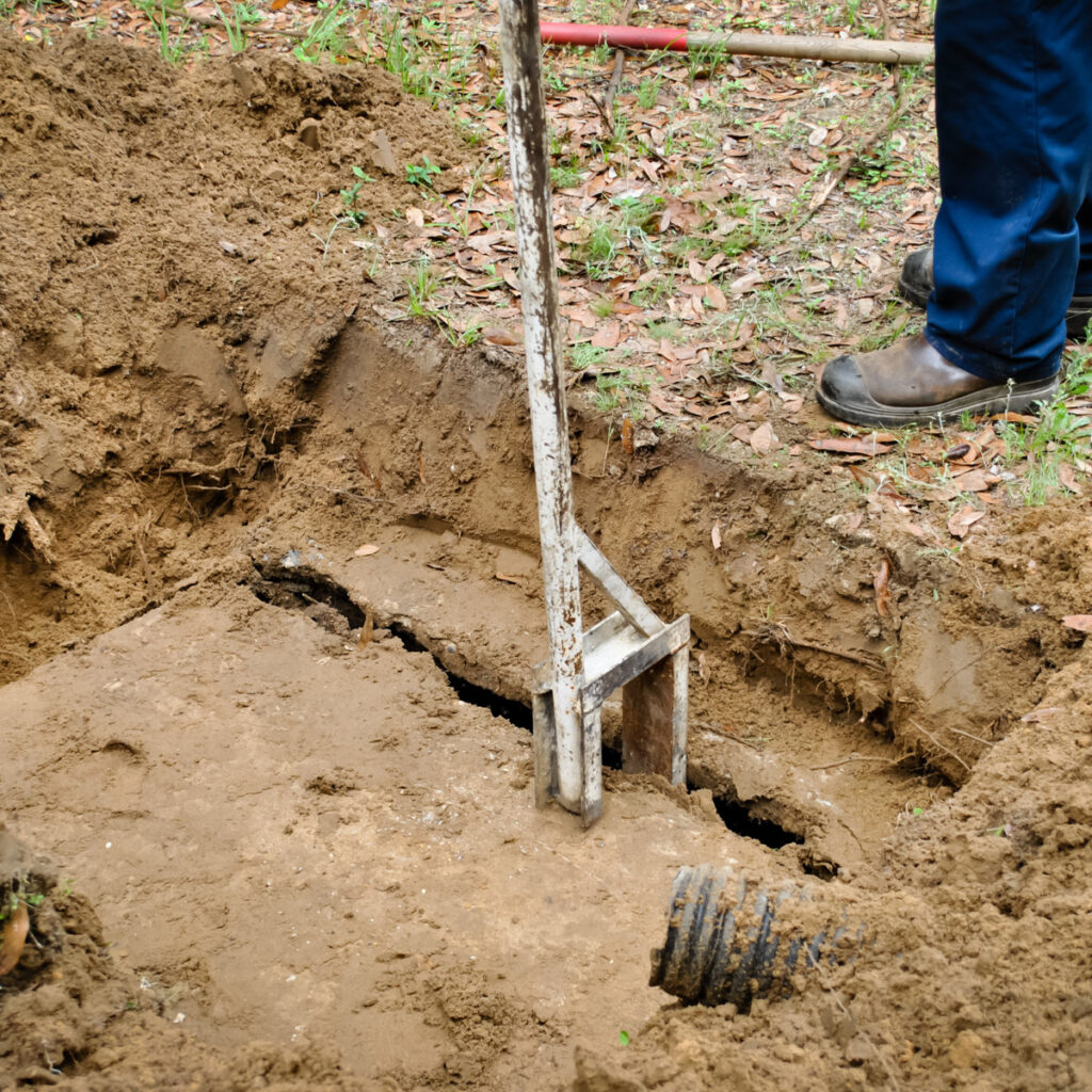 septic tank technician opening the tank