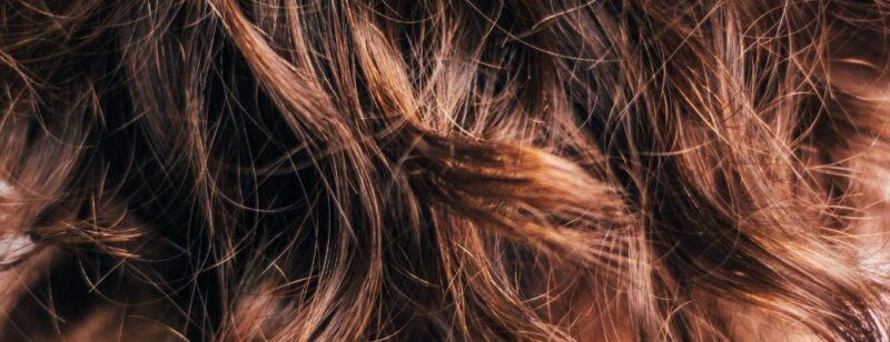 close up view of brown hair with waves