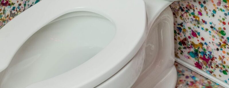 white toilet seat and bowl with water inside