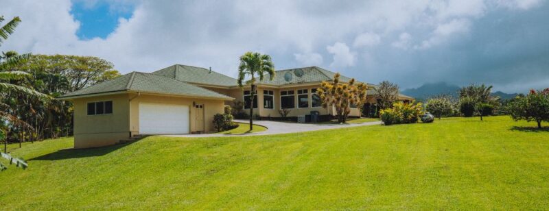 house in tropical region with big green yard