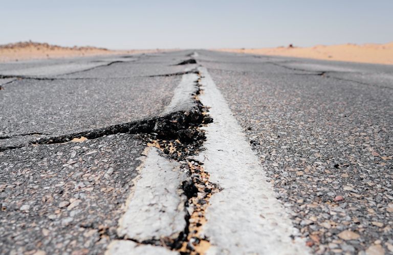 desert road with cracks down the middle