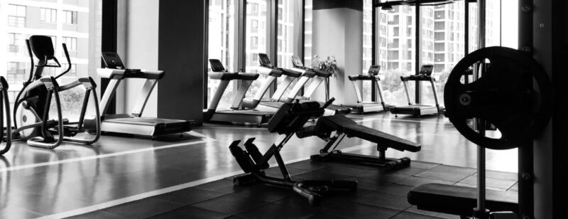 gym with treadmills and weight machines in the city