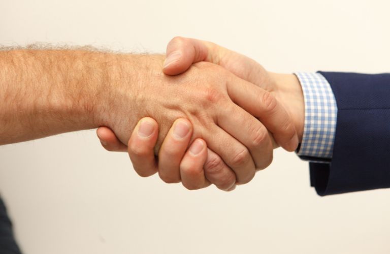 two people shaking hands