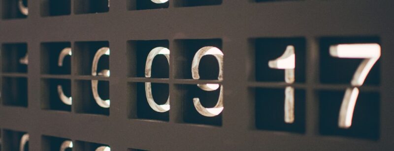 large number counter sign displaying various numbers in pairs