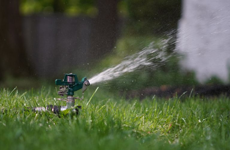 lawn sprinkler spraying water