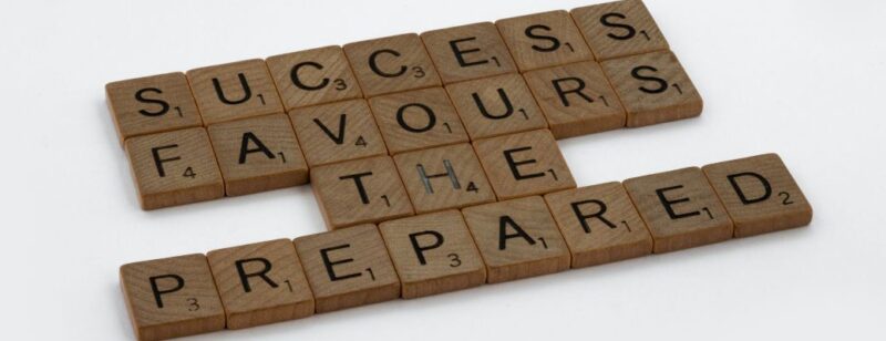 letter block tiles spelling out success favours the prepared