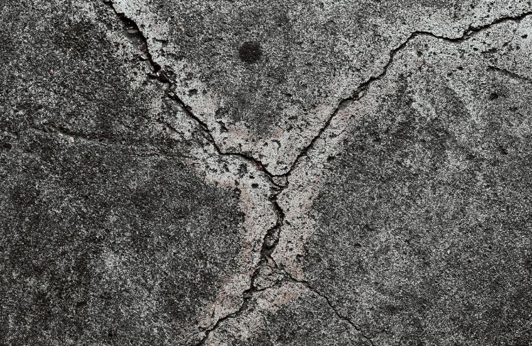 old cracks in concrete in a Y shape