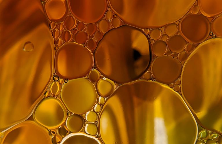 bubbles suspended in a yellow oil