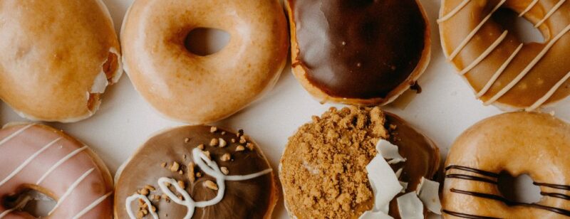 texture of donuts of various types icing glazed nuts frosting