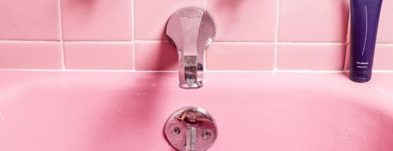 clean pink bathtub and tile