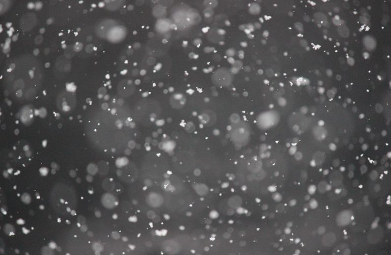 snow flurries falling from the sky
