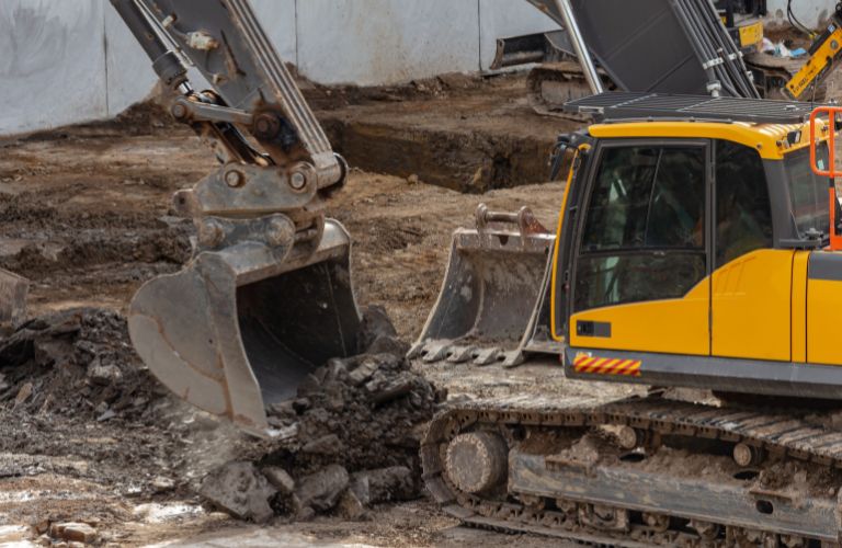 large digging machine digging in the ground